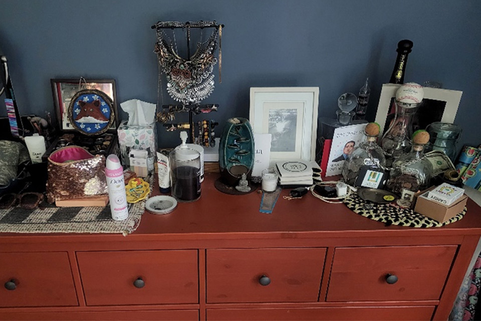 Chest of drawers with assorted objects on top