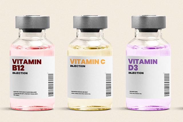Three vials of fluid saying 'Vitamin B12, Vitamin C, Vitamin D3'